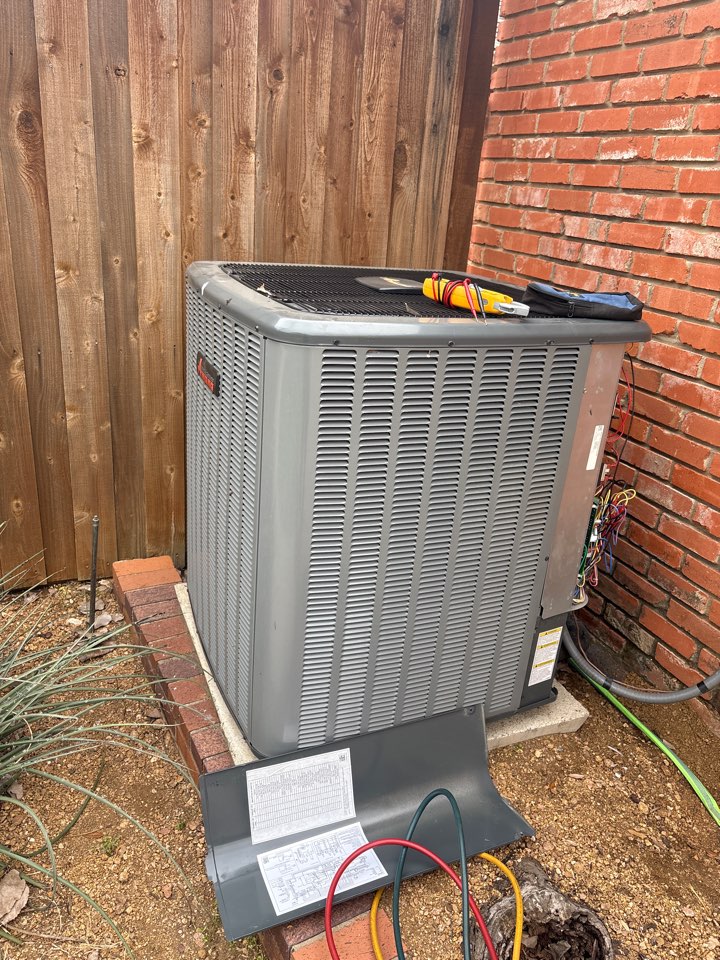 Photo of an AC unit in Dallas being worked on by an expert technician from Air Patrol