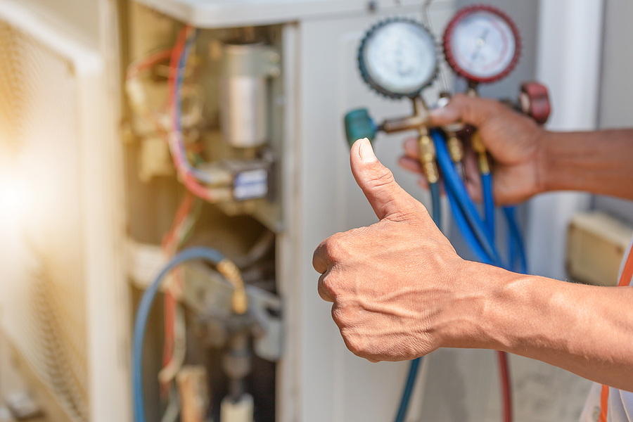 A technician in Lewisville giving a thumbs up